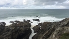 Surfer Gets Caught on Rocks