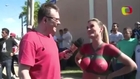 Female Reporter shows off her body paint in front of recording youngsters