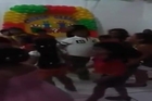 Video shows 2 burglars break into children's party killing one child and injuring 2 others.