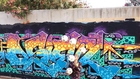 Guy Juggles Soccer Balls in Front of Graffiti