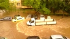 An idiot driving on flooded street