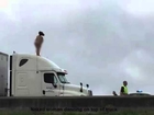 'Naked woman dancing on top of truck'|'shuts down Highway 290'
