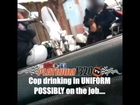 Cop drinking in uniform possibly on the job