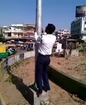 Traffic police rescues pigeon caught in pole