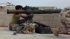 A Syrian Sunni Arab citizen tank hunter engages an assad crime dynasty tank, with a TOW ATGM: Zilaqiat barrier