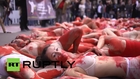 France: 'Blood' covered vegans enact 'human slaughter' in Paris