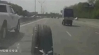 Car hit by run away wheel on highway