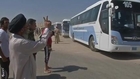 Scores of Iraqis flee ISIL fighting, scores more volunteer for battle