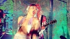 Miley Cyrus Smokes Weed Onstage, Wears Thong and Wig